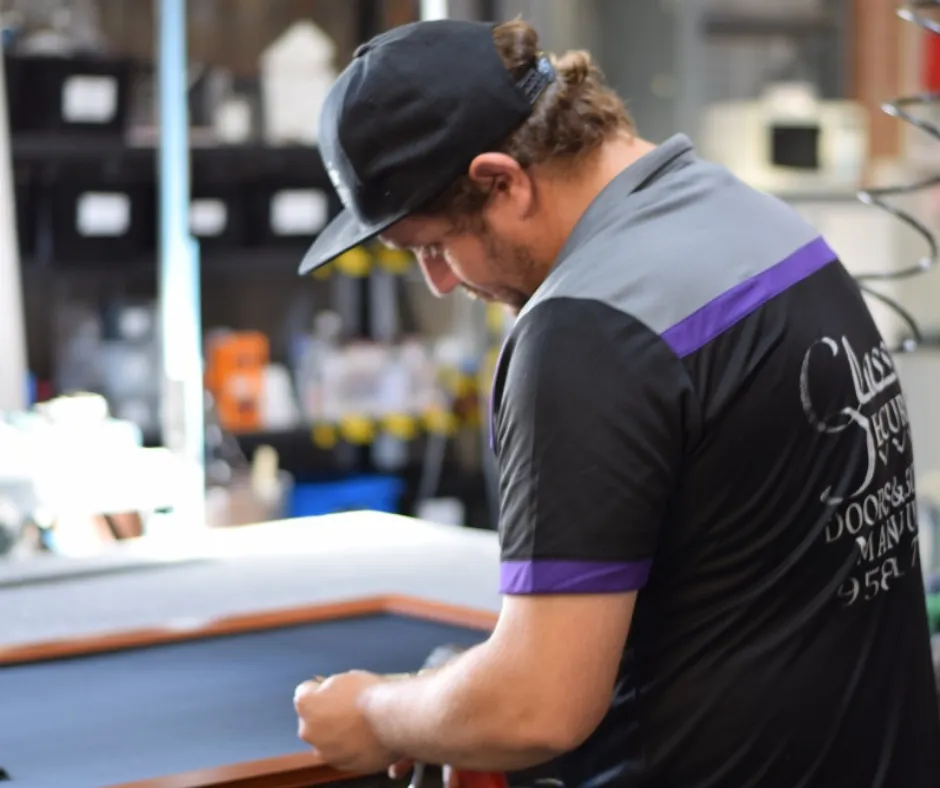 Classic Security technician assembling a frame at the workbench
